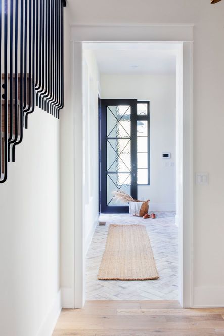 The stairs feature a beautiful custom iron railingโฆso gorgeous!
