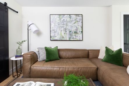 SHOP THE LOOK: Nolita Sectional, Safflower Green Velvet Pillow, Valeria Coffee Table, Banded Shade Floor Lamp, Naomi End Table, Rhapsody in Green Art