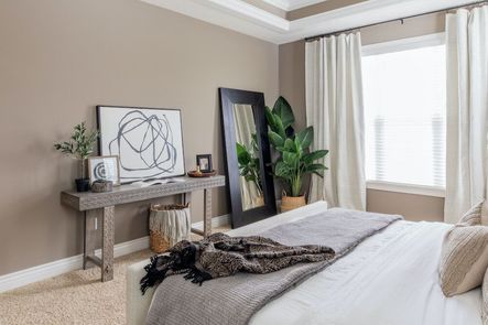 SHOP THE LOOK: Black Circles IV, Stone Doorstop, Village Wooden Bowl, Small Genie Brass Vase, Faux Olive Tree, Balboa Carved Console Table, Rina Natural Lumbar Pillow, Daphne Bed