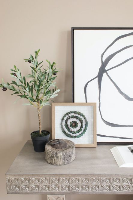 SHOP THE LOOK: Stone Doorstop, Faux Olive Tree, Balboa Carved Console Table