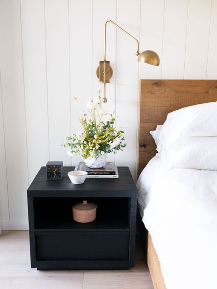 Beautiful brass accents are carried throughout the home but we particularly love this swing sconce.
