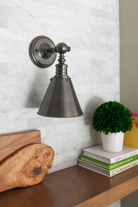 The Darien Sconce perfectly highlights these open shelves.
