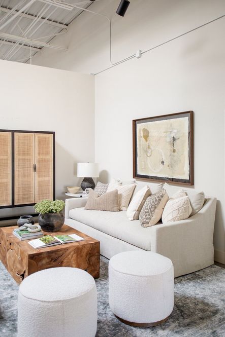 SHOP THE LOOK: Grace Sofa, Vert Coffee Table, Sinclair Round Ottomans, Paper Mache Bowl, Artifact Graystone Table Lamp, Lincoln Rug