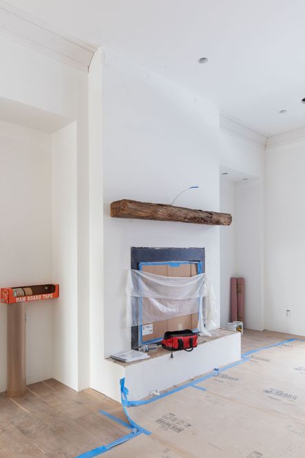 Progress of the fireplace in our stone bluff project. Next up, adding stone with an over-grouted finishing touch.